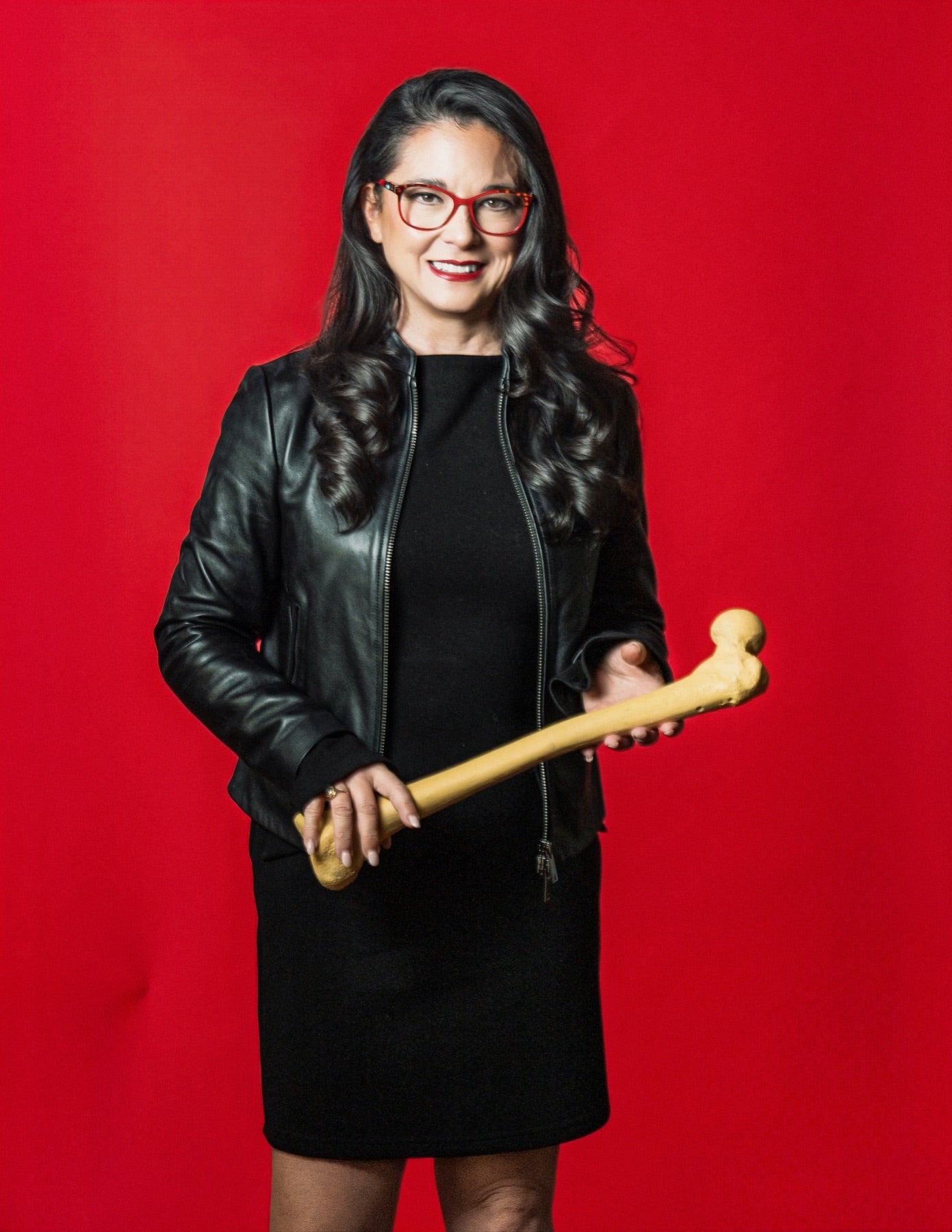 Dr. Vonda Wright holding a bone
