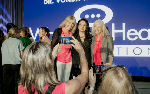 Women posing together at a Dr. Vonda Wright event